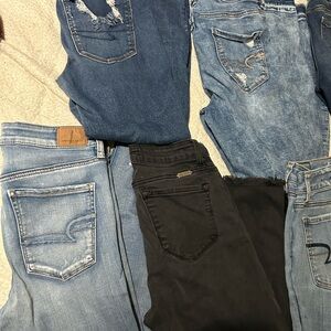 7 pair of American Eagle skinny jeans